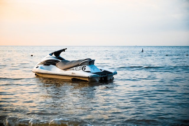 a jet ski in the water for how to clean jet ski cover