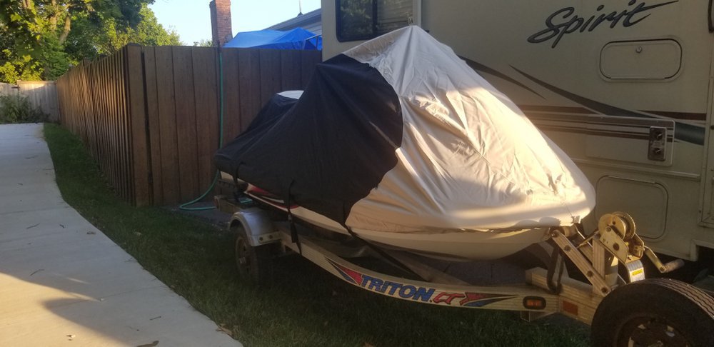 a jet ski under a cover for how to clean jet ski cover
