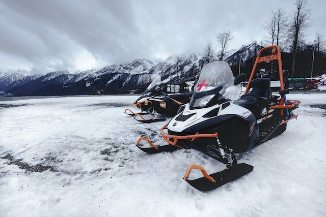 a snowmobile on the snow for how to measure for a snowmobile cover